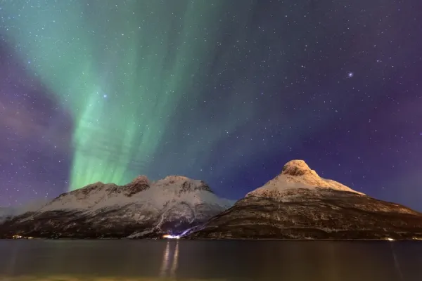 northern-lights-illuminates-snowy-peaks-oteren-11781307.jpg.webp